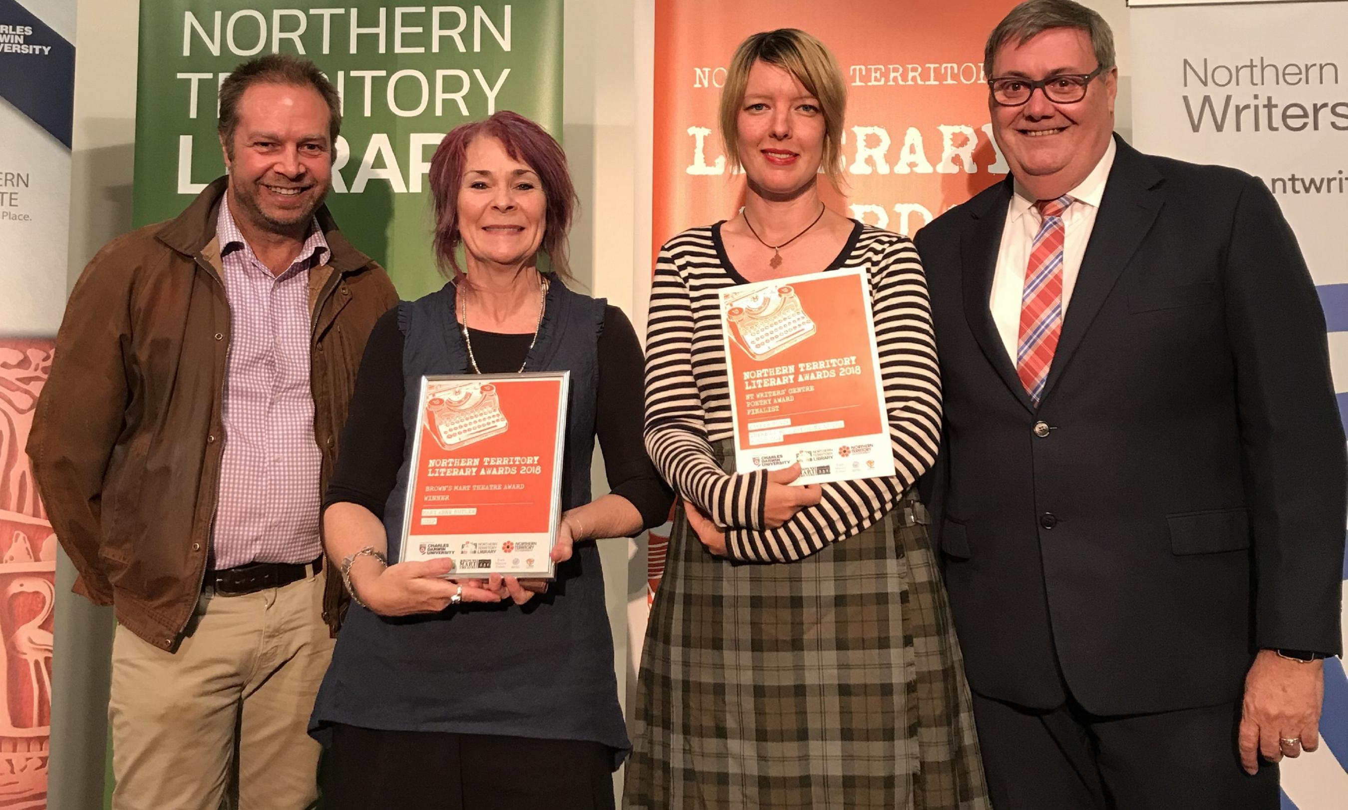 Four people standing, two women holding their awards