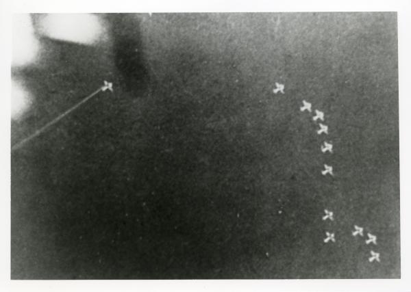 Image from ground looking up at Japanese aeroplanes in formation over Fenton. 